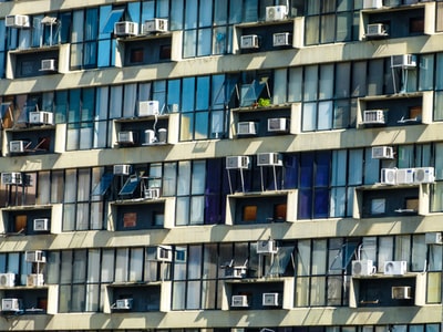 The grey concrete apartment during the day
